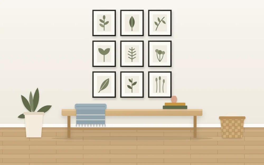 Three-by-three grid of nine identical thin black frames with white mats and botanical leaf prints above a long oak bench