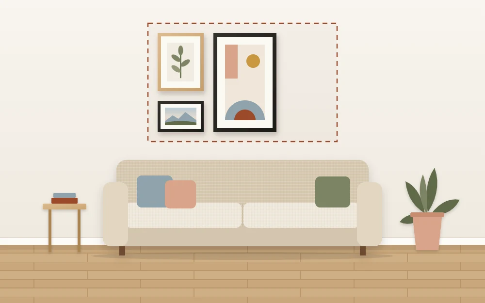 A wall above a sofa with a dashed rectangle marking the display area, narrower than the sofa, with three frames inside