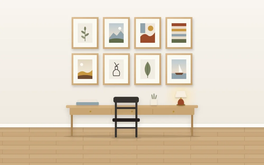 Two rows of four identical oak frames with white mats holding varied simple art, hung in a tidy band above a slim writing desk